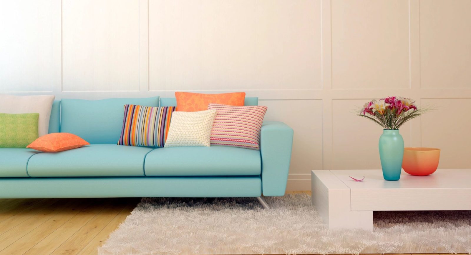 Light blue sofa with colorful pillows.